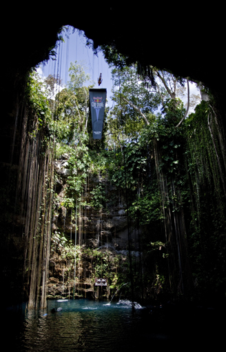 Sacha Kutsenko of the Ukraine dives from the 27.25 metre platform during the first round of the second stop of the Red Bull Cliff Diving World Series at Ik Kil cenote in Chichen Itza, Yucatan, Mexico on April 9th 2011.