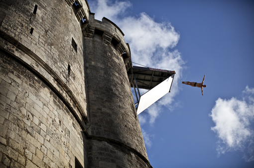 Alain Kohl of Luxembourg dives from the 27.5 metre platform during the fourth stop of the Red Bull Cliff Diving World Series at the Saint Nicolas Tower in La Rochelle, France on June 18th 2011.