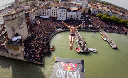 Artem Silchenko of Russia dives from the 27.5 metre platform at the fourth stop of the Red Bull Cliff Diving World Series at La Rochelle, France on June 18th 2011.