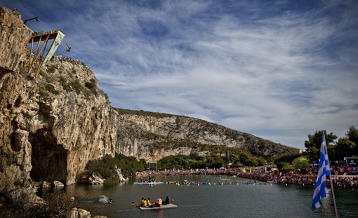 Michal Navratil of the Czech Republic dives from the 26.8 metre platform during the third stop of the Red Bull Cliff Diving World Series at Lake Vouliagmeni in Athens, Greece on May 22nd 2011.