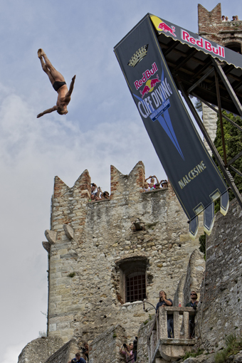 Gennady Kutsenko of Ukraine dives from the 27 metre platform on Scaliger Castle during the qualification session of the fifth stop of the Red Bull Cliff Diving World Series, Malcesine, Italy on July 23nd 2011.