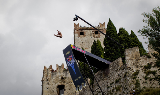Slava Polyeshchuk of the Ukraine dives from the 27 metre platform during the second round of the of the fifth stop of the Red Bull Cliff Diving World Series, Malcesine, Italy on July 24rd