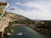 Sacha Kutsenko of Ukraine dives from the 26.8 metre platform during the third stop of the Red Bull Cliff Diving World Series at Lake Vouliagmeni in Athens, Greece on May 22nd 2011.
