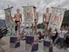 Second placed Artem Sichenko (L) of Russia, winner Gary Hunt (C) of Great Britain and third placed Michal Navratil (R) of the Czech Republic celebrate on the podium after the fifth stop of the Red Bull Cliff Diving World Series at Lake Garda in Malcesine, Italy on July 24th 2011.